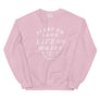 Pink unisex sweatshirt with wording in white, "Sleep on Land, Live on Water" written in black artistic lettering on front. Underneath this is very small semi circle stating "Mutineer Bay" centered with small anchor. All lettering and images are in white.