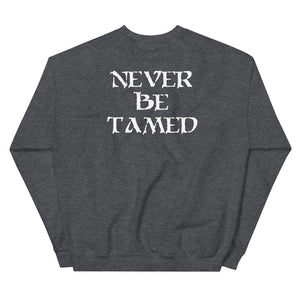 Grey unisex sweatshirt wit white "Mutineer Bay" logo on front left breast. On the back is Mutineer Bay slogan "Never Be Tamed." written on three horizontal lines in white IM Fell font