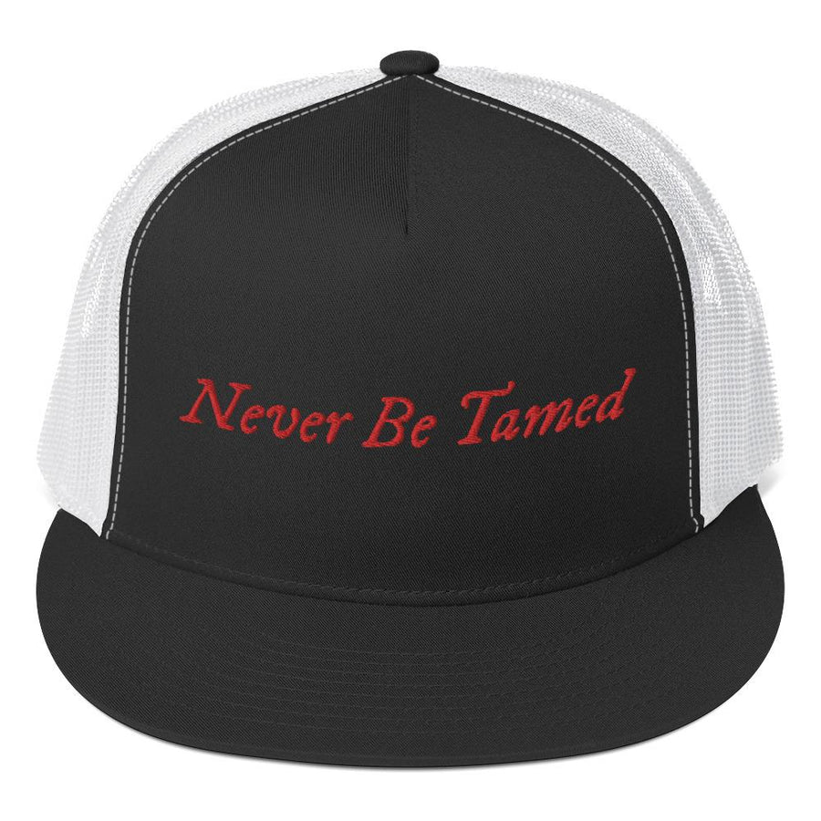 Stylish trucker cap with the phrase "Never Be Tamed" written horizontally in IM Fell font on the front of cap. Cap brim is black, front of cap is black, sides of cap are white. All lettering is in Red.