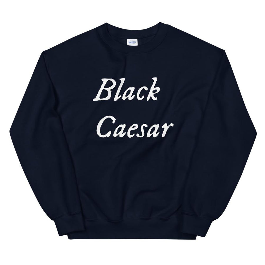 Black sweatshirt with "Black Caesar" written in White, on two horizontal lines across the front. Black Caesar (died 1718) was a legendary 18th-century African pirate. The legends say that for nearly a decade, he raided shipping from the Florida Keys and later served as one of Captain Blackbeard's, a.k.a. Edward Teach's, crewmen aboard the Queen Anne's Revenge